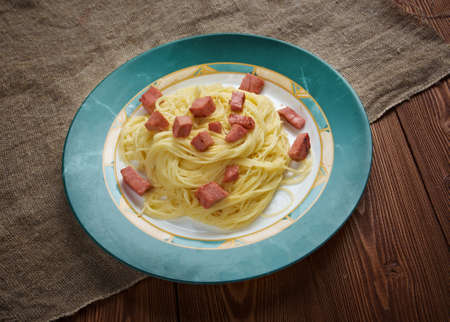 Capellini  pasta with cream sauce Alfredo  and sausage.の写真素材
