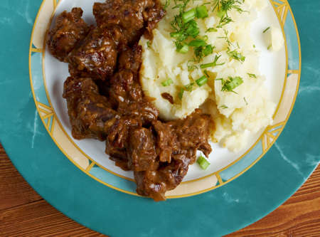 carbonnade de boeuf a la Flamande  with mashed potatoes. traditional Belgian sweet-sour beef and onion stew made with beer, and seasoned with thyme, bay and mustard.の写真素材