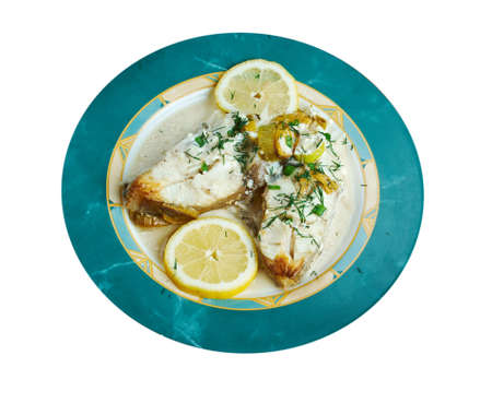 Halibut in Lemon Cream. served with lemon, fresh vegetablesの写真素材