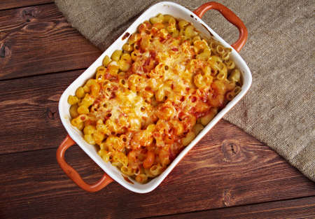 pasta Elbow macaroni  bake with pancetta, tomato sauce and mozzarellaの写真素材