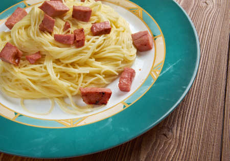 Capellini  pasta with cream sauce Alfredo  and sausage.の写真素材