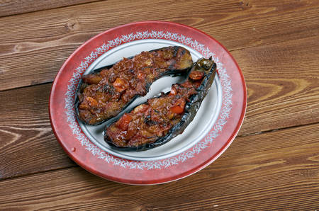 Imam bayildi - dishes found in Turkish cuisine.whole braised eggplant stuffed with onion, garlic and tomatoes,の写真素材