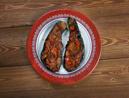 Imam bayildi - dishes found in Turkish cuisine whole braised eggplant stuffed with onion, garlic and tomatoes,の写真素材