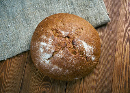 Composition with salami sausages with fresh country  bread .farm-styleの写真素材