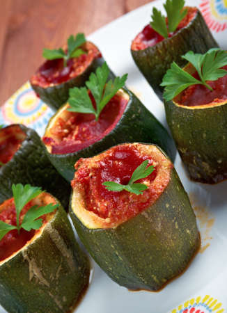 Cuor di zucchina -italian baked zucchini stuffed with cheese and tomatoesの写真素材