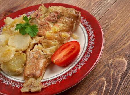 Baked red grouper with potato and  appleの写真素材