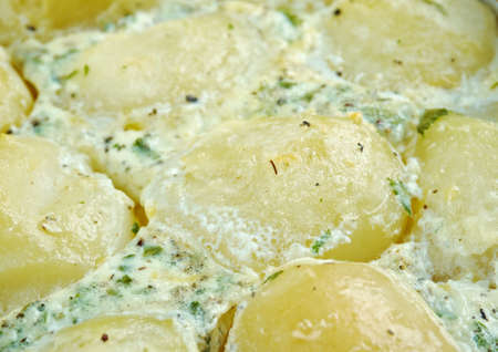 Patatine novelle alla crema di basilico - Italian baked potato with cream and basilの写真素材