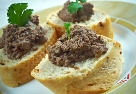 homemade meat snack chicken liver pate with bread on wooden table