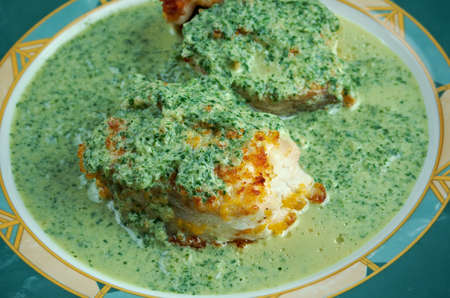 Merluza en salsa verde - fried fish with green sauceの写真素材