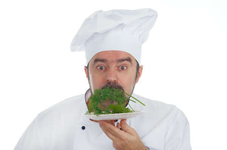Portrait of chief cook  sample greens isolated on whiteの写真素材