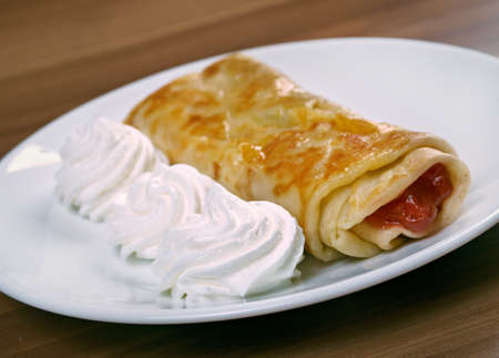 stuffed pancakes with raspberry jam and cream sauce