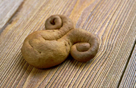 kozuli - Russian Christmas gingerbread over wooden background close up.traditional pagan rite...