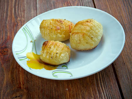 hasselback potato - Swedish version of baked potatoes.の写真素材