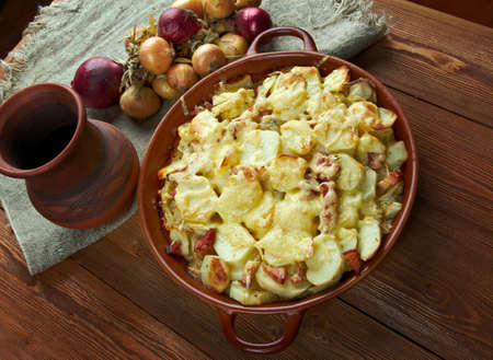 Tartiflette -  French dish from the Savoie and Haute Savoie region. made with potatoes, reblochon cheese, lardons and onions.の写真素材