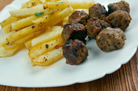 Boulet a la liegeoise - meatballs with sauce and french fries.の写真素材