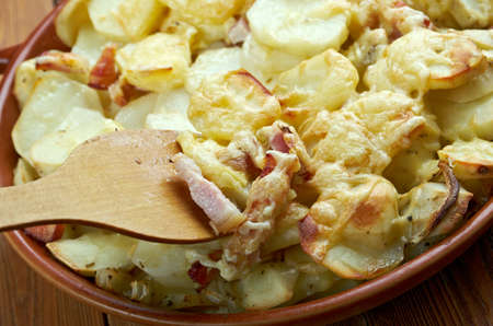 Tartiflette -  French dish from the Savoie and Haute Savoie region. made with potatoes, reblochon cheese, lardons and onions.の写真素材