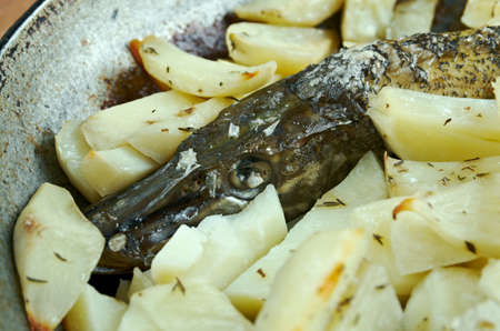 Baked pike with potatoes.home cooking.country cuisineの写真素材