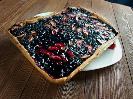 Blueberry pie and berries on rustic wooden tableの写真素材