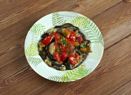 Tombet -  traditional vegetable dish from Majorca. sliced  aubergines and red bell peppers  fried in olive oil.の写真素材