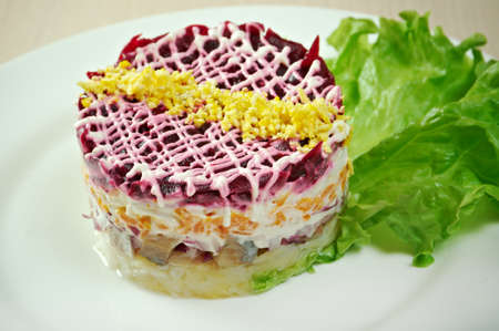 fish and beets  salad  with vegetableの写真素材