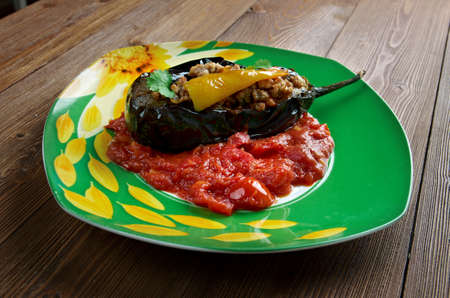 KarnÄ±yarÄ±k - Turkish and Iranian dish consisting of eggplant stuffed with a mix chopped onions, garlic, black pepper, tomatoes, parsley and ground meat.の写真素材