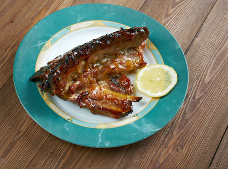 Spicy pork ribs in orange sauce