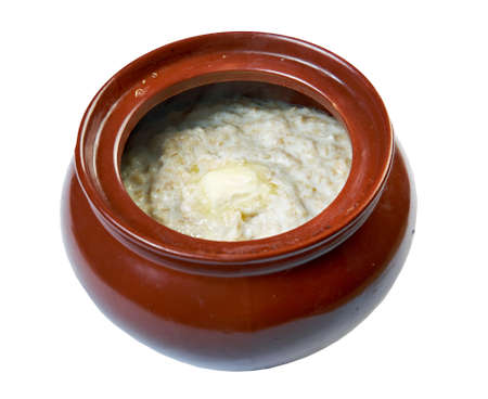 oatmeal in pot isolated on white backgroundの写真素材
