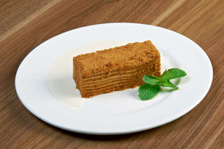 cake Napoleon on a white plate.close up