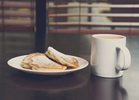 cup of cocoa and Fresh pancakes with sugar.の写真素材