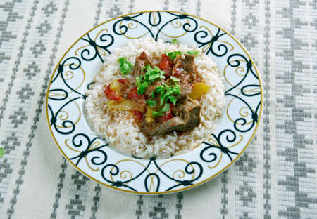 Alinazik kebab - home-style Turkish dish . topped  cubes of sauteed lamb,  served with rice pilaf.の写真素材
