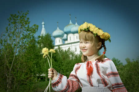 Russian little girl  on a orthodox church .の写真素材
