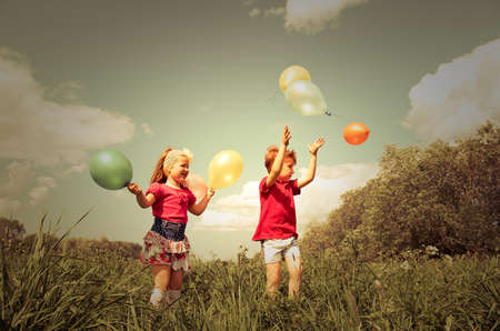 children with balloon outdoorの写真素材