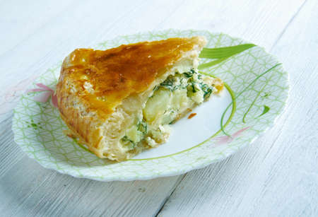 Pate aux pommes de terre   speciality of the Limousin and the Allier . main ingredients are potato slices and crÃ¨me fraÃ®che, which are used to fill a puff pastry crust.の写真素材