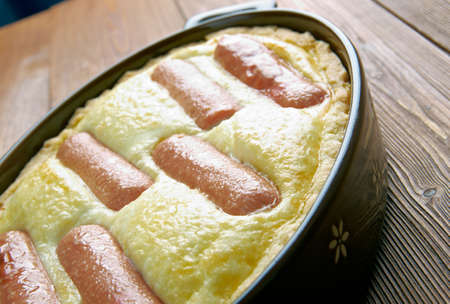 Toad in the hole - traditional British dish consisting of sausages in Yorkshire pudding batterの写真素材