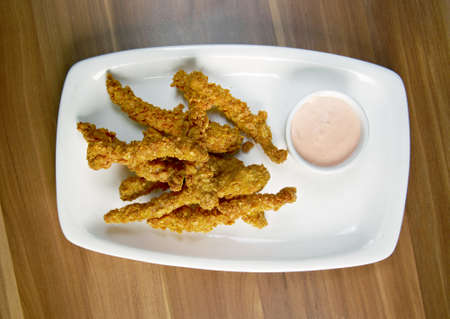 chicken fried croquettes on white platter