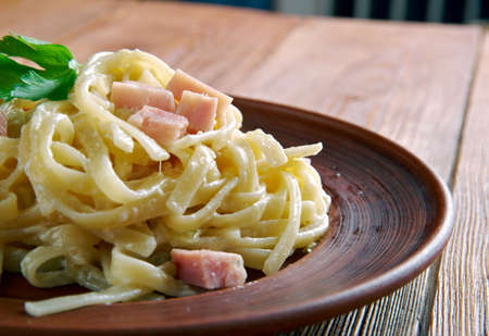 Fettuccine alla papalina - pasta with prosciutto, parmesan, butterの写真素材