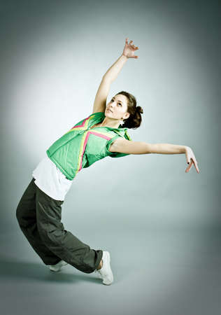 modern style dancer posing on  gray backgroundの写真素材