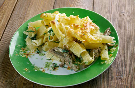 Timballo - Italian dish consisting of baked pasta, rice, or potatoes, one or  other ingredients ,cheese, meat, fish, vegetables, and fruitの写真素材