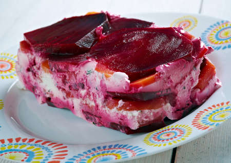 beet terrine  with goat cheese and carrots .close upの写真素材