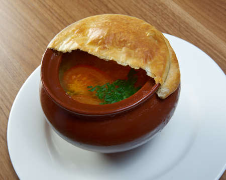 Russian vegetable soup in ceramic pot.の写真素材