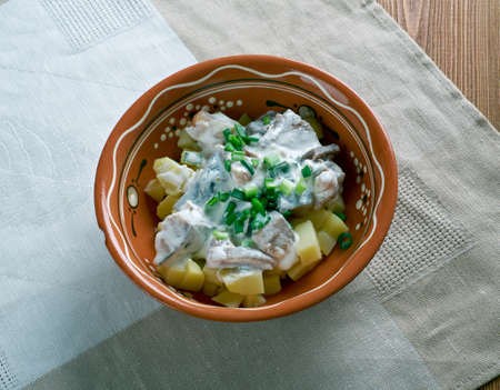 Estonian Silgu kartulisalat . salad of herring, potatoes with sour creamBaltic cuisineの写真素材