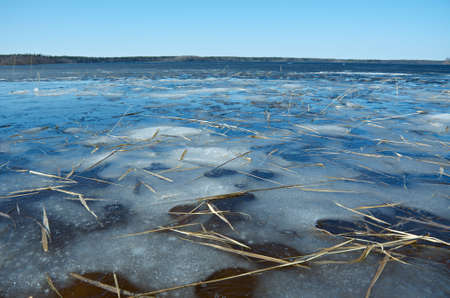 Russian  landscape Arkhangelsk Oblast . spring flooding on the lake,Thin ice on the water