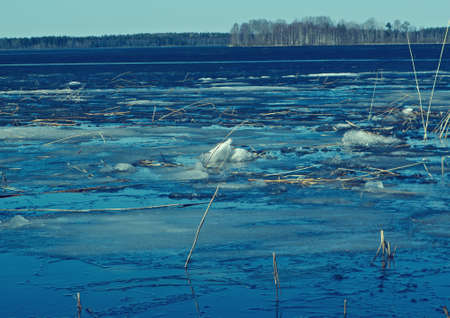 Russian  landscape Arkhangelsk Oblast . spring flooding on the lake,Thin ice on the waterの写真素材