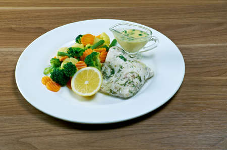 cod with vegetables and lemon sauceの写真素材