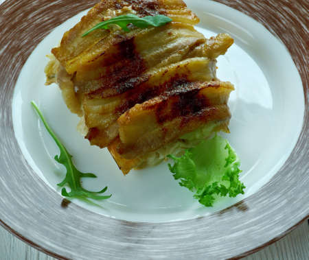 Baked cod wrapped in bacon.