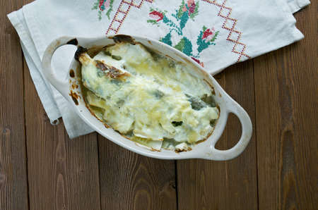 Baked cod with cream sauce in ceramics.bacalao al horno en salsaの写真素材