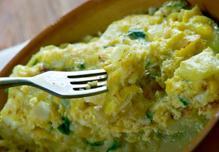 Tortilla de Bacalao.Spanish tortilla with vegetables and cod.の写真素材