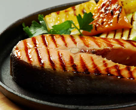 salmon steak with vegetablesの写真素材