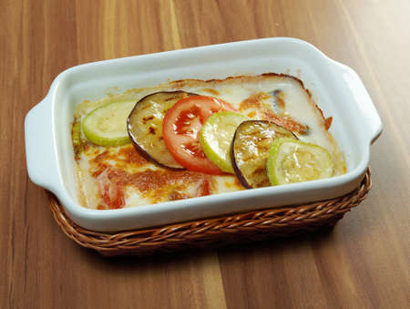 delicious homemade vegetable lasagna with tomato, paprika, onion and zucchiniの写真素材