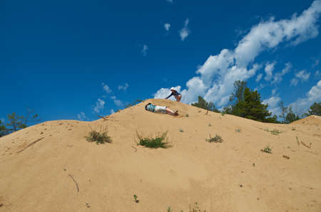 Children play on the dunes . Sandy shore of Lake Baikal,Turka villageの写真素材